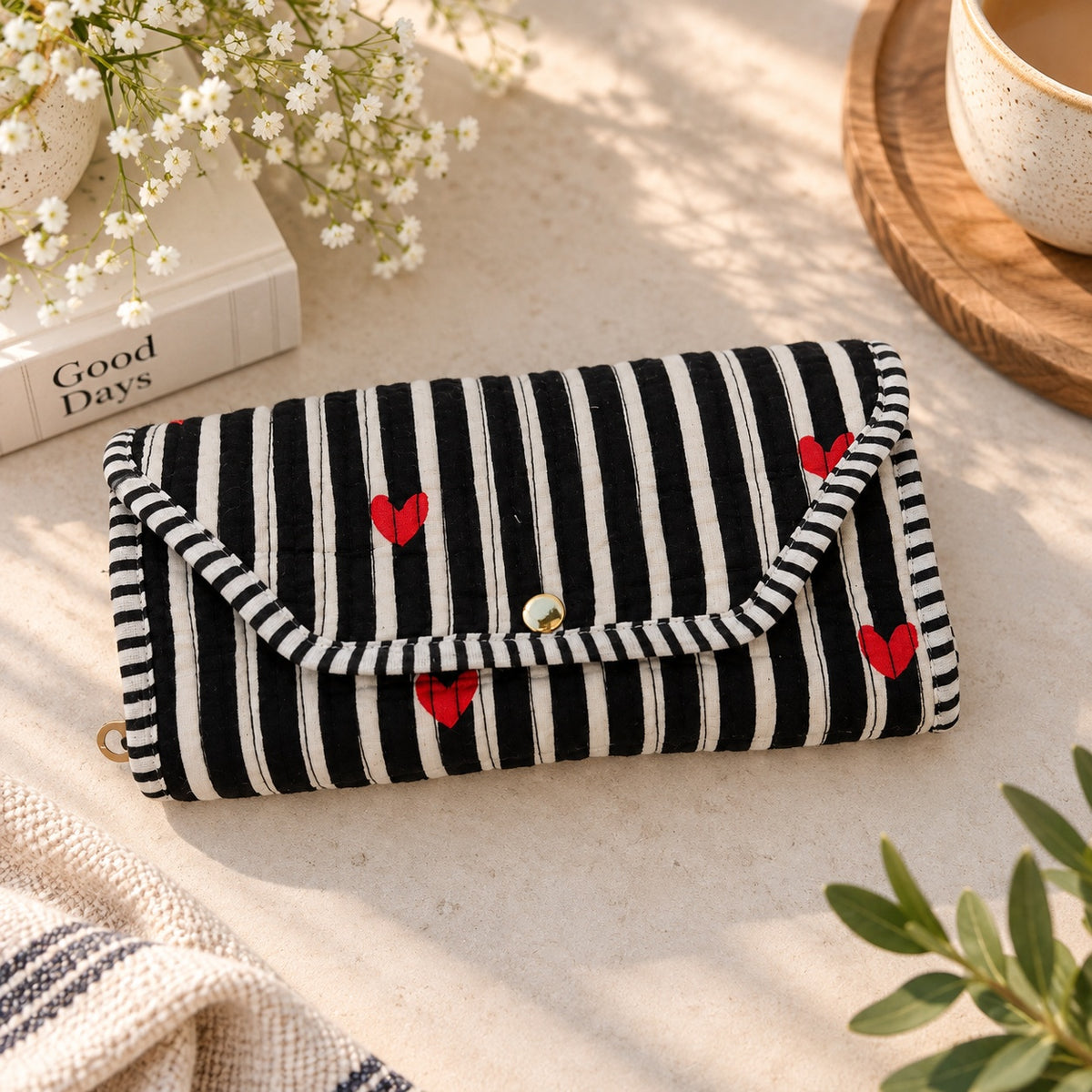 Organizer unfolded showing two zippered compartments and a top flap pocket