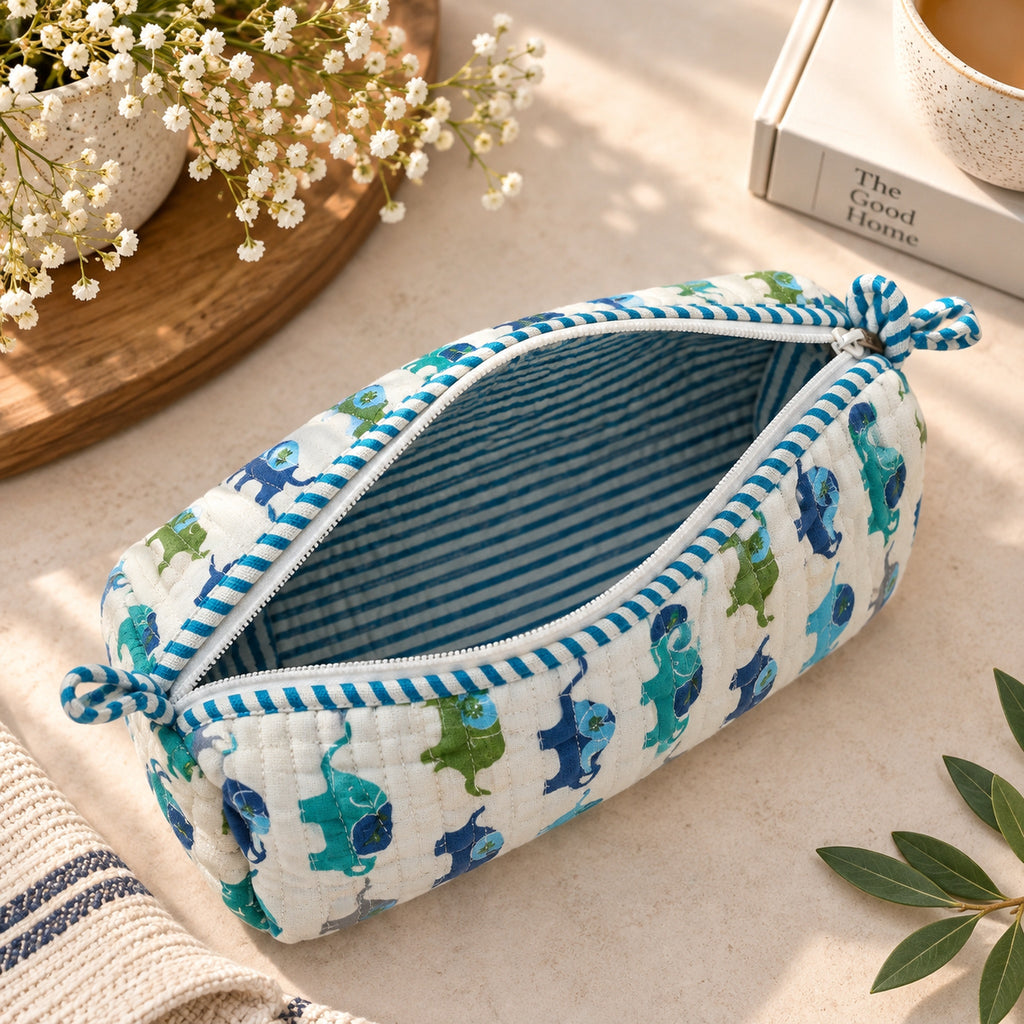 Open blue elephant quilted pouch showing striped cotton lining