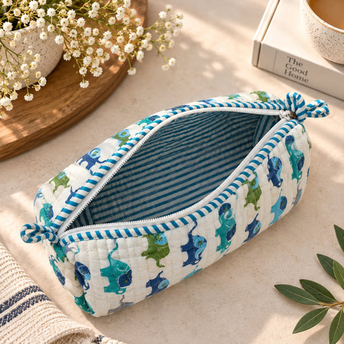 Open blue elephant quilted pouch showing striped cotton lining